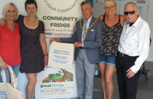 Phot of Mayor Cllr Paul Holbrook with Pass It On volunteers at official project opening