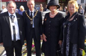 Photo of Deputy Town Mayor Cllr John Puttick, Town Mayor Cllr Paul Holbrook, Deputy Lord Lieutenant Amanda Hamblin and Town Mayor's Consort Cllr Barbara Holbrook at the town's official Proclamation event held at the Hailsham War Memorial on Sunday 11th September 2022