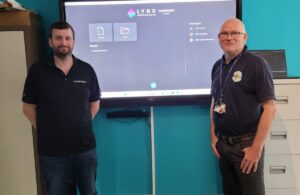 Photo of Clevertouch Technologies representative with youth Service Manager Andy Joyes at the Square Youth Cafe