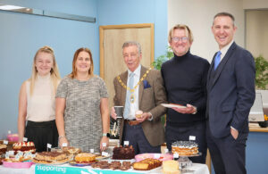 Photo of Town Mayor Cllr Paul Holbrook at Crane & Co's coffee morning event in aid of St Wilfrid's Hospice (26 October 2023)