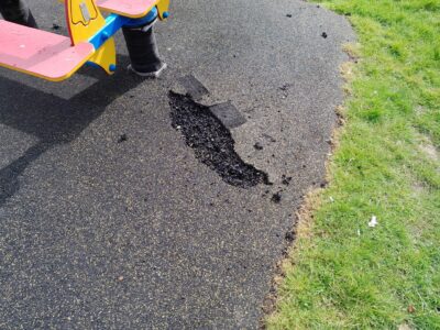 Photo of vandalism to the wet-pour surface at the Western Road children's play area