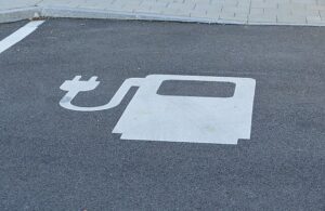 Public domain photo of a EV charging point painted car park surface sign