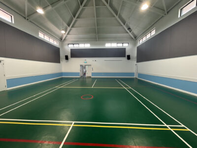 Photo of the recently repainted/redecorated main hall of the James West Community Centre