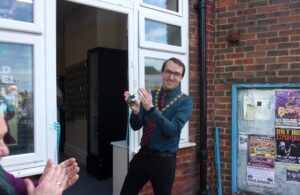 Photo of the Town Mayor Cllr Chris Bryant at the official opening of Nat 20 Gaming on 16 May 2026. Photo courtesy of Nat 20 Gaming