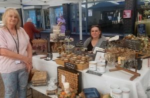 Photo of Cllr Anne Marie Ricketts with a stallholder at September 2026's Hailsham Street Market in Vicarage Field